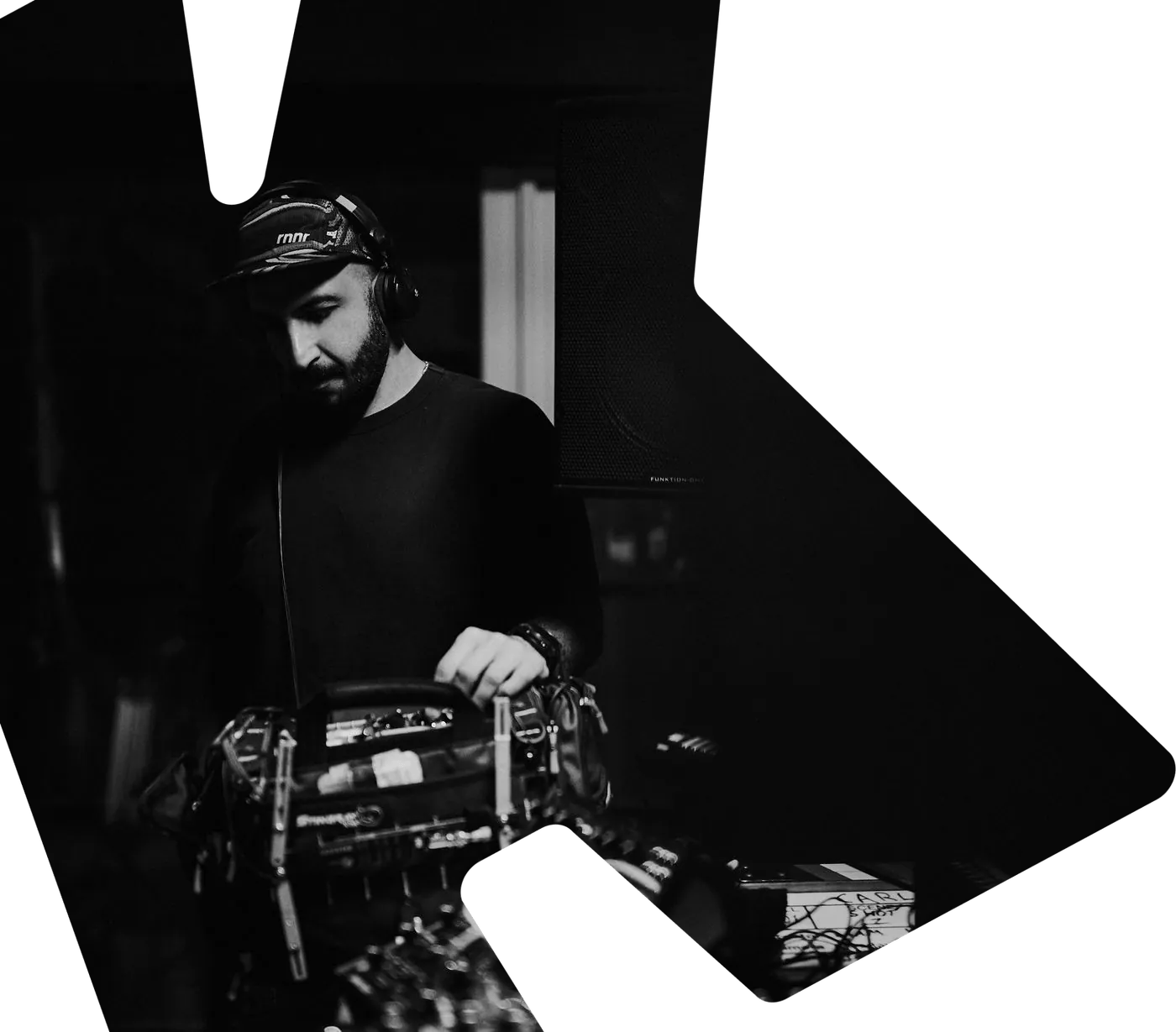 Mike Jaballah at his sound cart on a Carl Cox shoot, in black and white