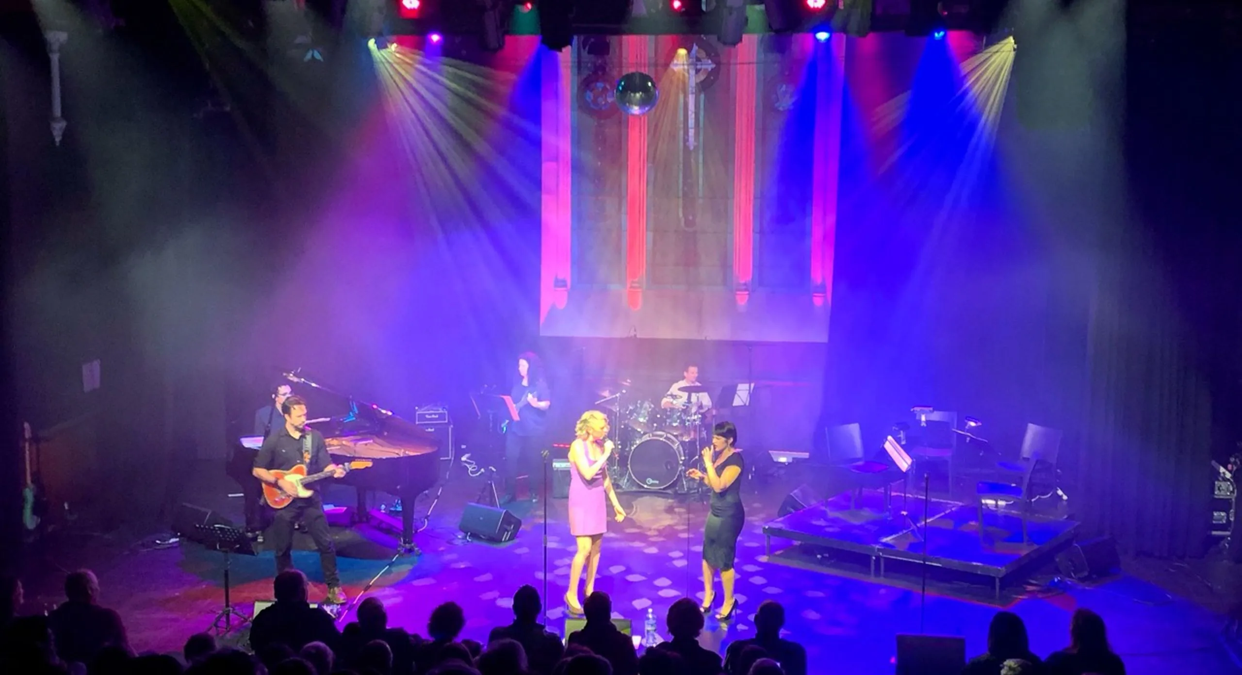 Performers on stage during a live show at Chapel Off Chapel