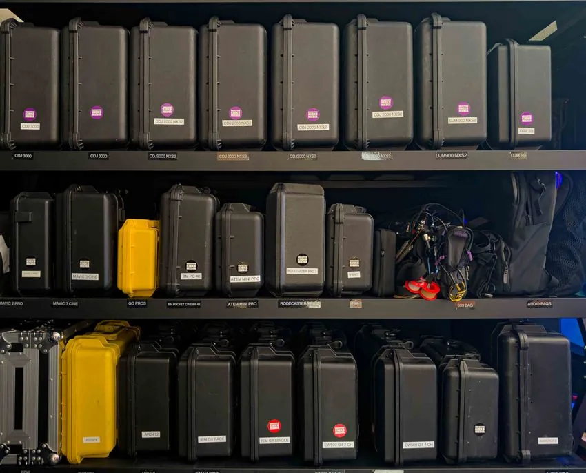 Shelves stocked with Creative Kicks audio hire gear
