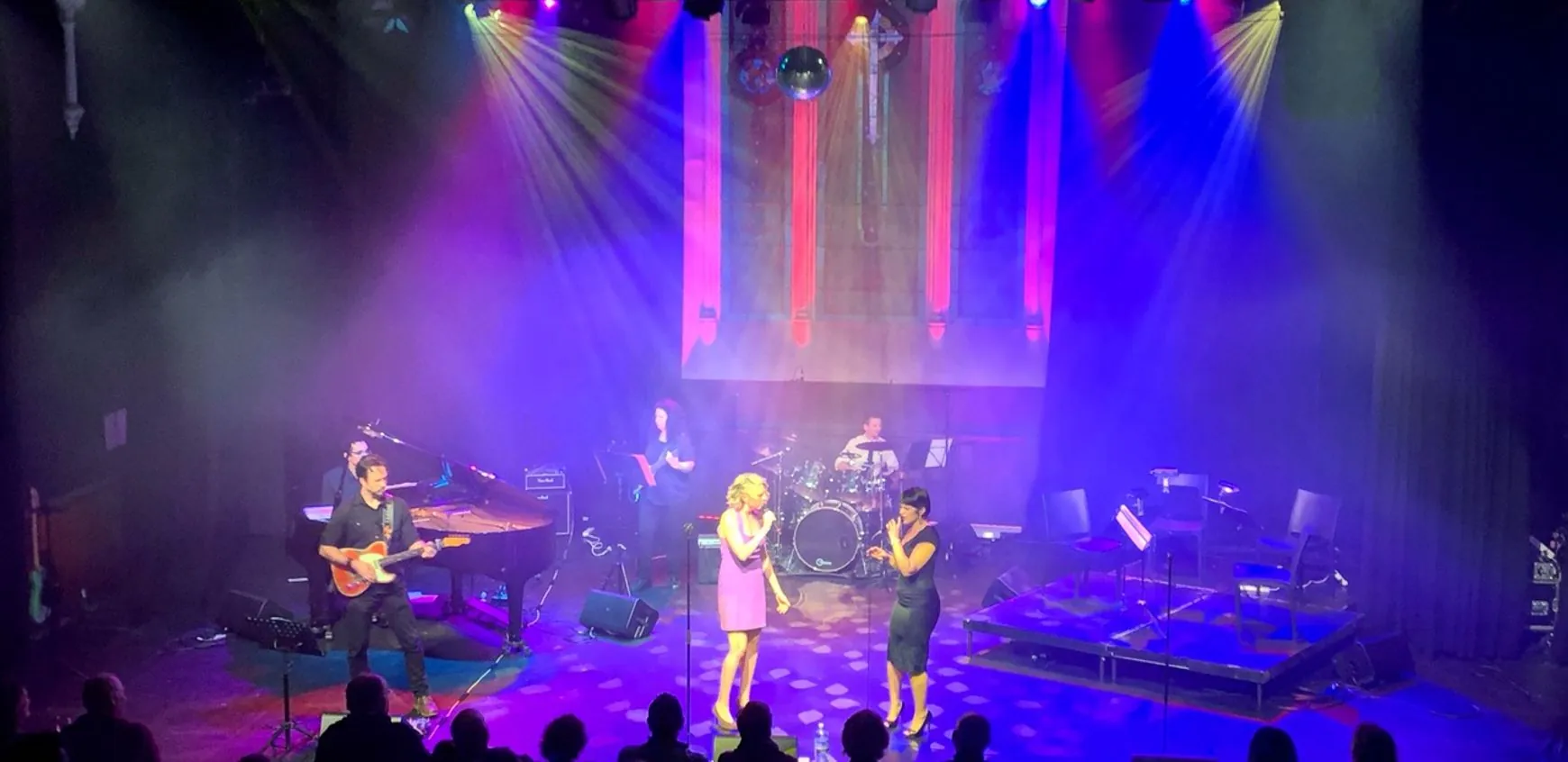 Performers on stage during a live show at Chapel Off Chapel