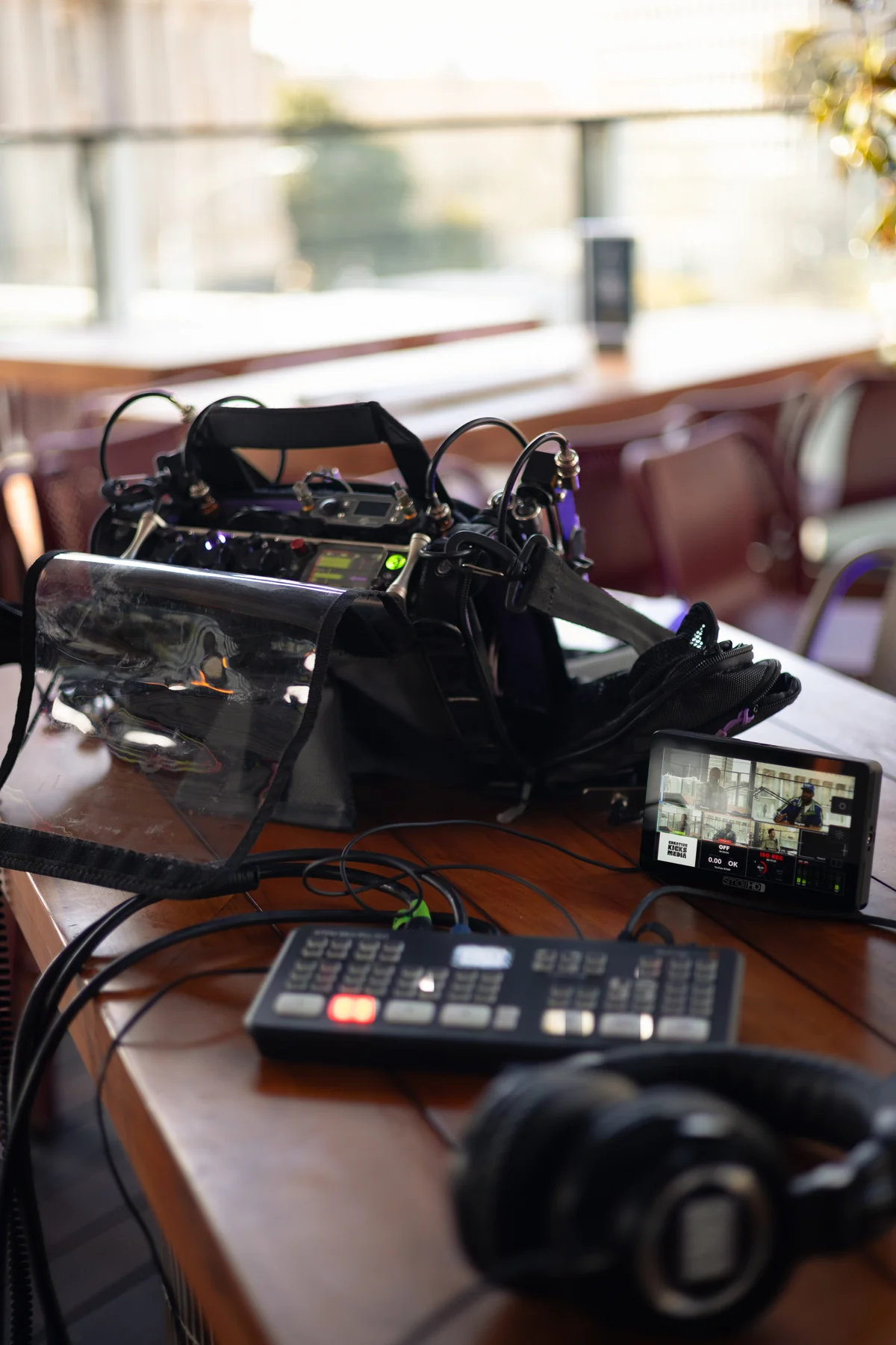 Podcast recording equipment and video monitor set up on a table