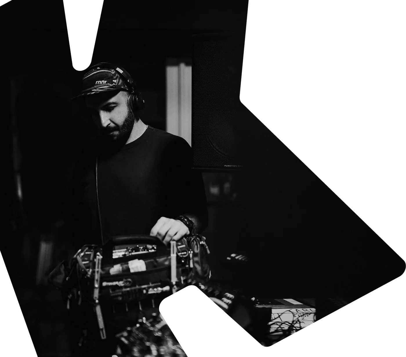 Mike Jaballah at his sound cart on a Carl Cox shoot, in black and white