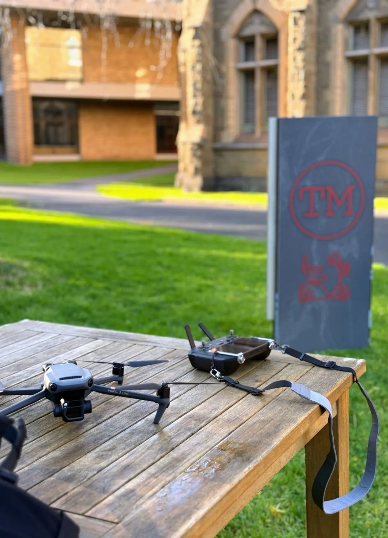 DJI Mavic 3 Cine drone and controller on a table, with the Taskmaster set behind