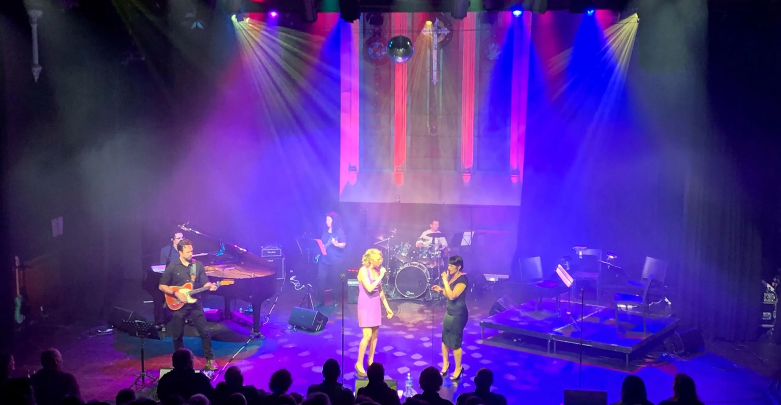 Performers on stage during a live show at Chapel Off Chapel